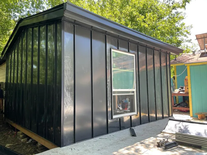 Black standing seam metal wall panels for Roof Inspection in Petal